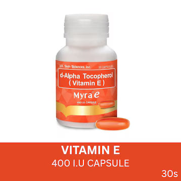 A white bottle of Myrae d-Alpha Tocopherol (Vitamin E) capsules with an orange and white label, shown alongside two orange capsules on a white background with an orange banner at the bottom.