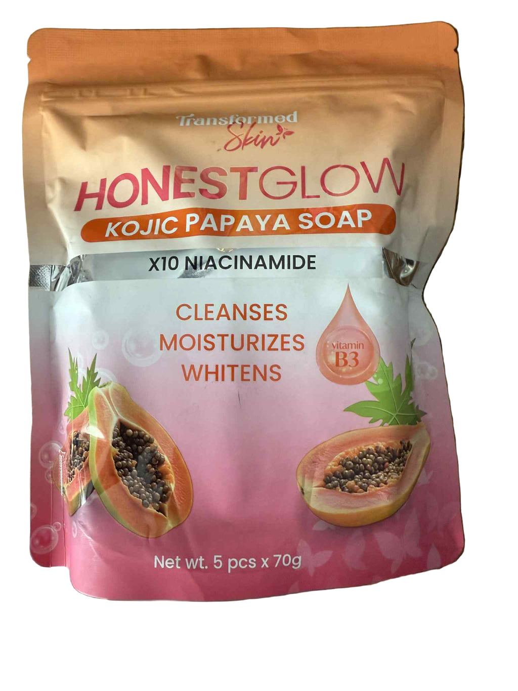 Honest Glow Kojic Papaya Soap packaging on a wooden surface