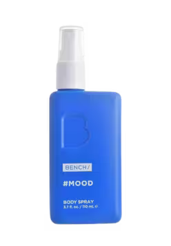 A blue rectangular body spray bottle with a white spray nozzle, labeled 'BENCH #MOOD BODY SPRAY' on a plain white background.