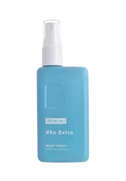 A light blue rectangular body spray bottle with a white spray nozzle, labeled 'BENCH/# So Extra BODY SPRAY' on a plain white background.