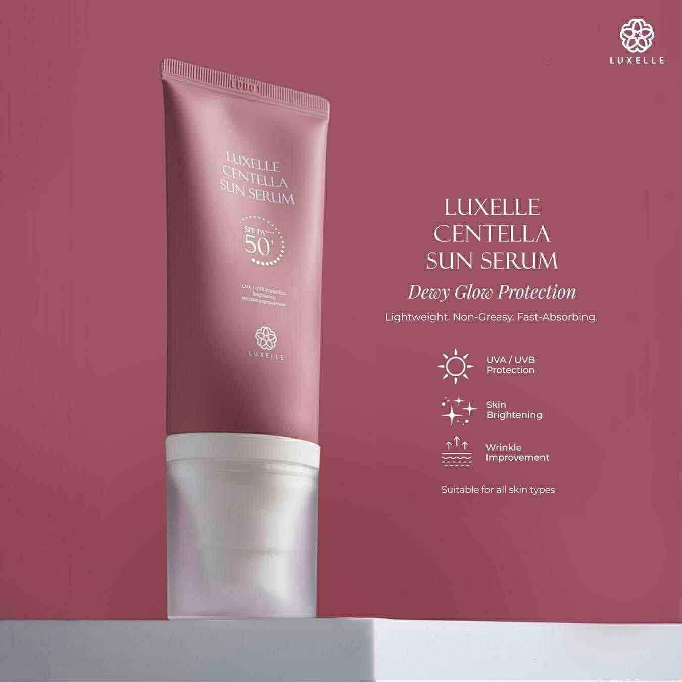 Luxelle Centella Sun Serum tube on a matching pink background