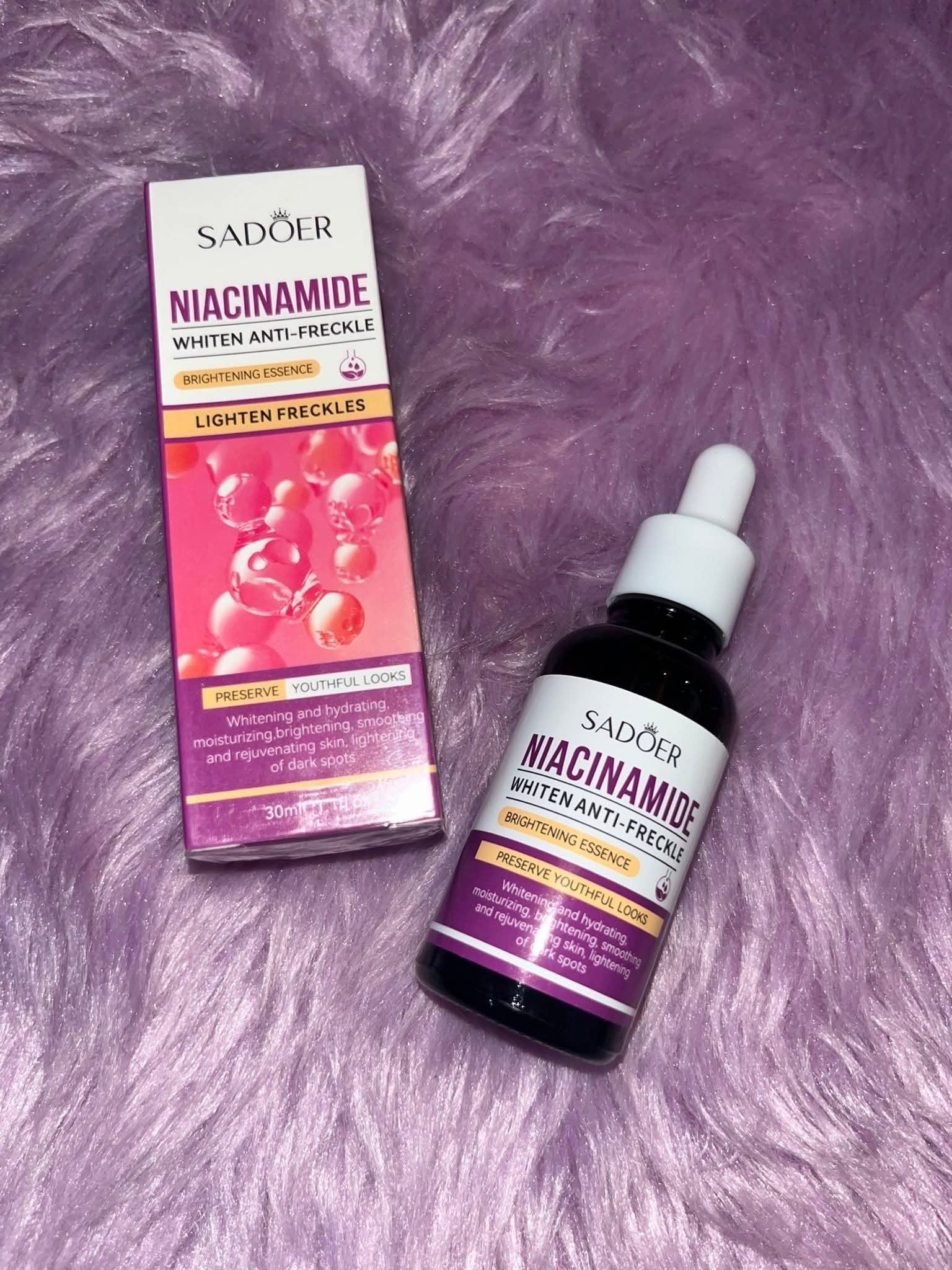 Sador Niacinamide Whitening Anti-Freckle product on a purple textured background