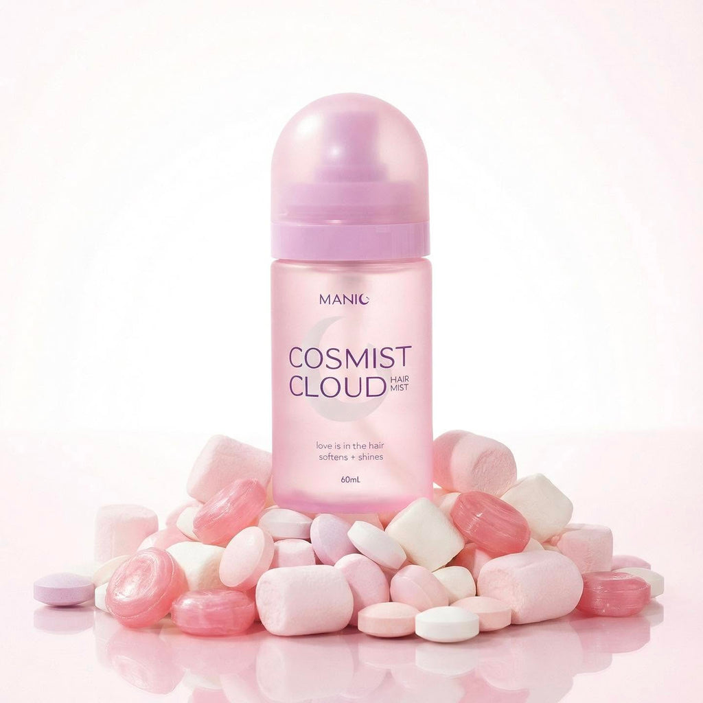 MANIC Cosmist Cloud hair growth serum bottle in pastel pink, surrounded by pink and white capsules on a clean white background.
