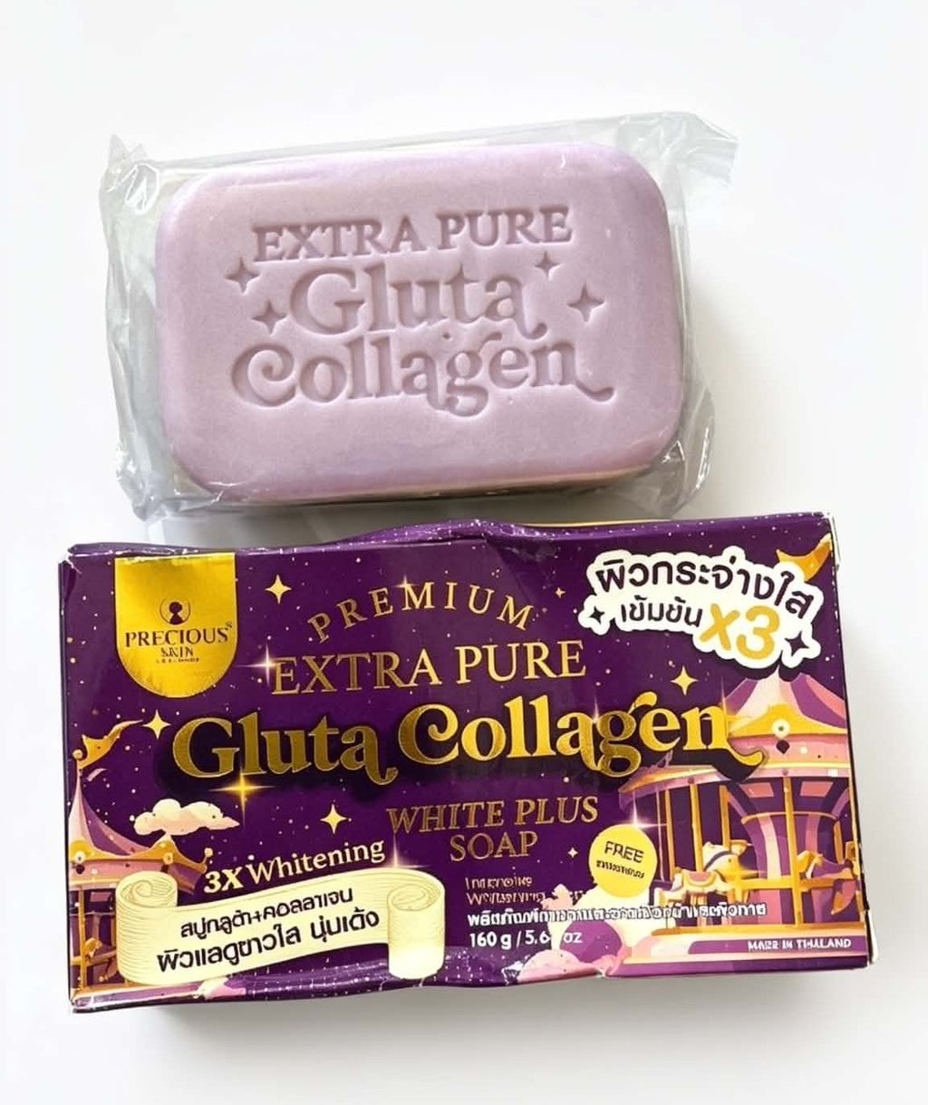 A bar of lavender-colored gluta collagen soap wrapped in clear plastic, placed above its purple and gold retail packaging box on a plain white background.