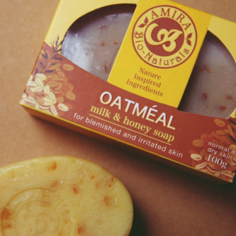 Oatmeal milk & honey soap with packaging on a brown surface