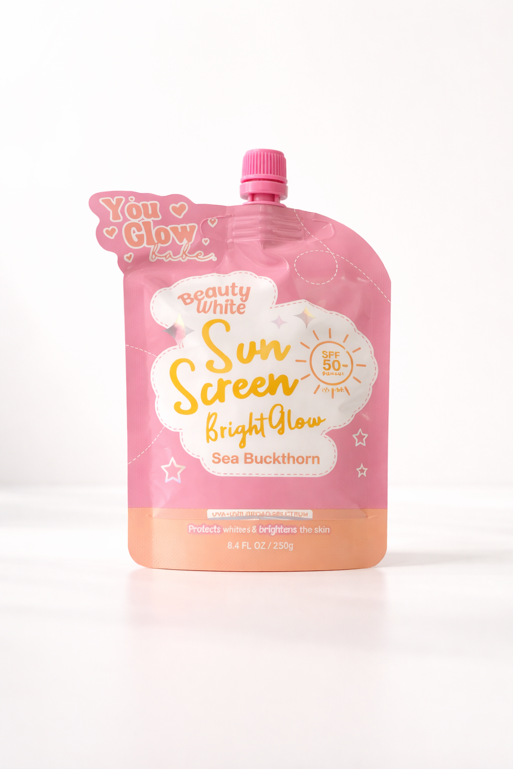 Pink pouch of sunscreen with branding on a white background