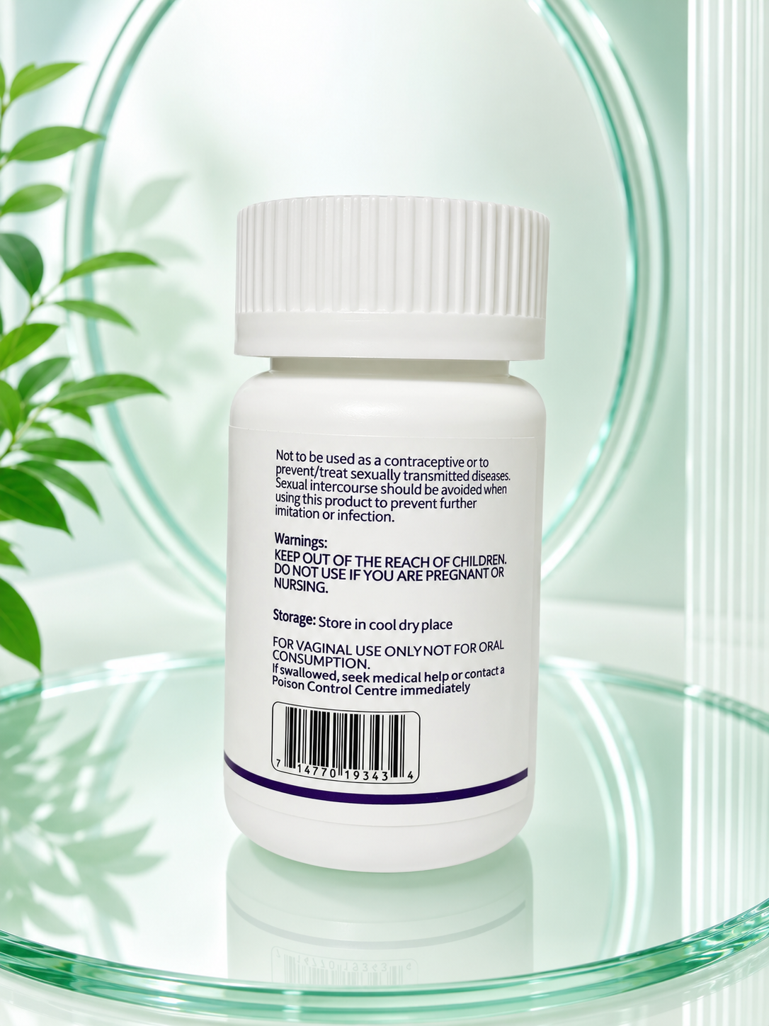 A white plastic bottle of vaginal use only product with printed black and purple text on the back, shown on a reflective light green surface with a glass rim and green leaves in the background.