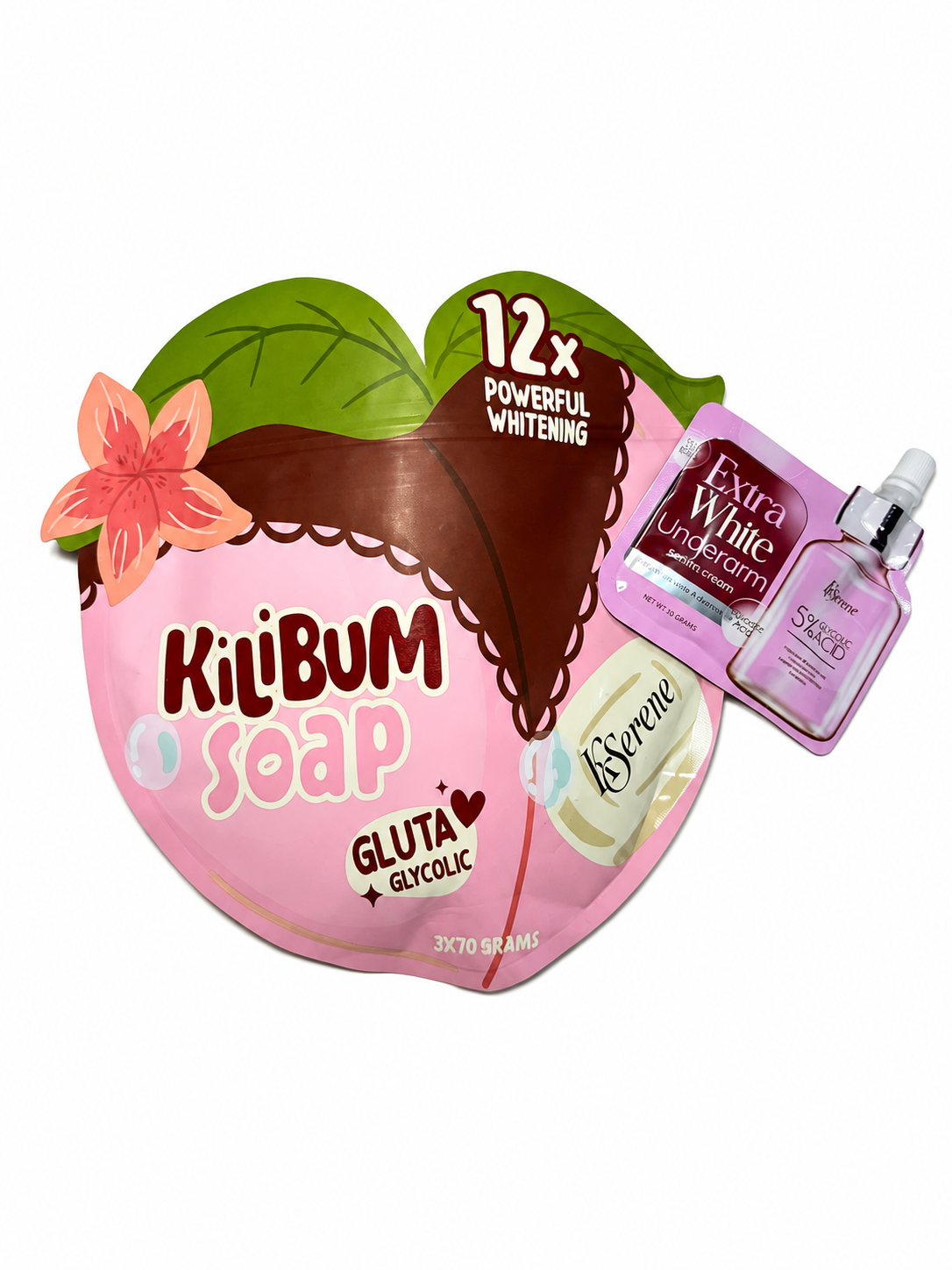 Kilibum Soap Glutaic Glycolic 30g heart-shaped soap bar packaging, featuring a pink and brown chocolate-heart design with a green leaf and pink flower, alongside two pink skincare product packets (Extra White Underarm and Step 26) on a white background.