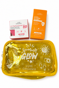 Luxe Organix summer glow sunscreen set featuring a translucent yellow zippered pouch, an orange Invisible Sunscreen box, and a pink UV Matte Powder box on a white background.