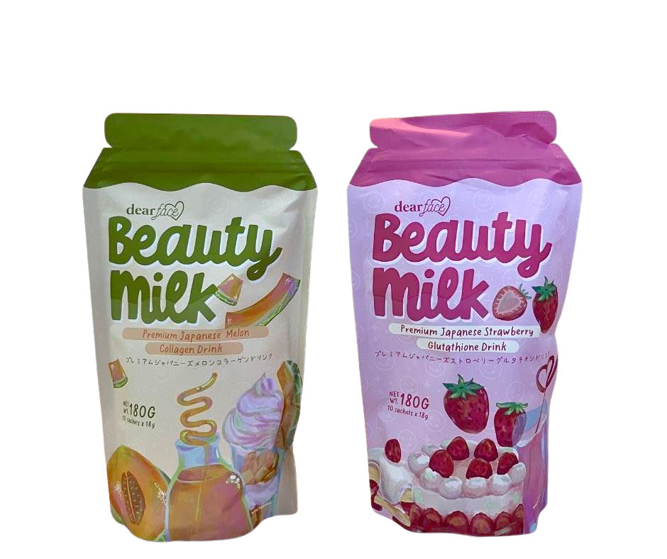 Two packages of 'Beauty Milk' drink mix, one with a green top and the other with a pink top, on a white background.
