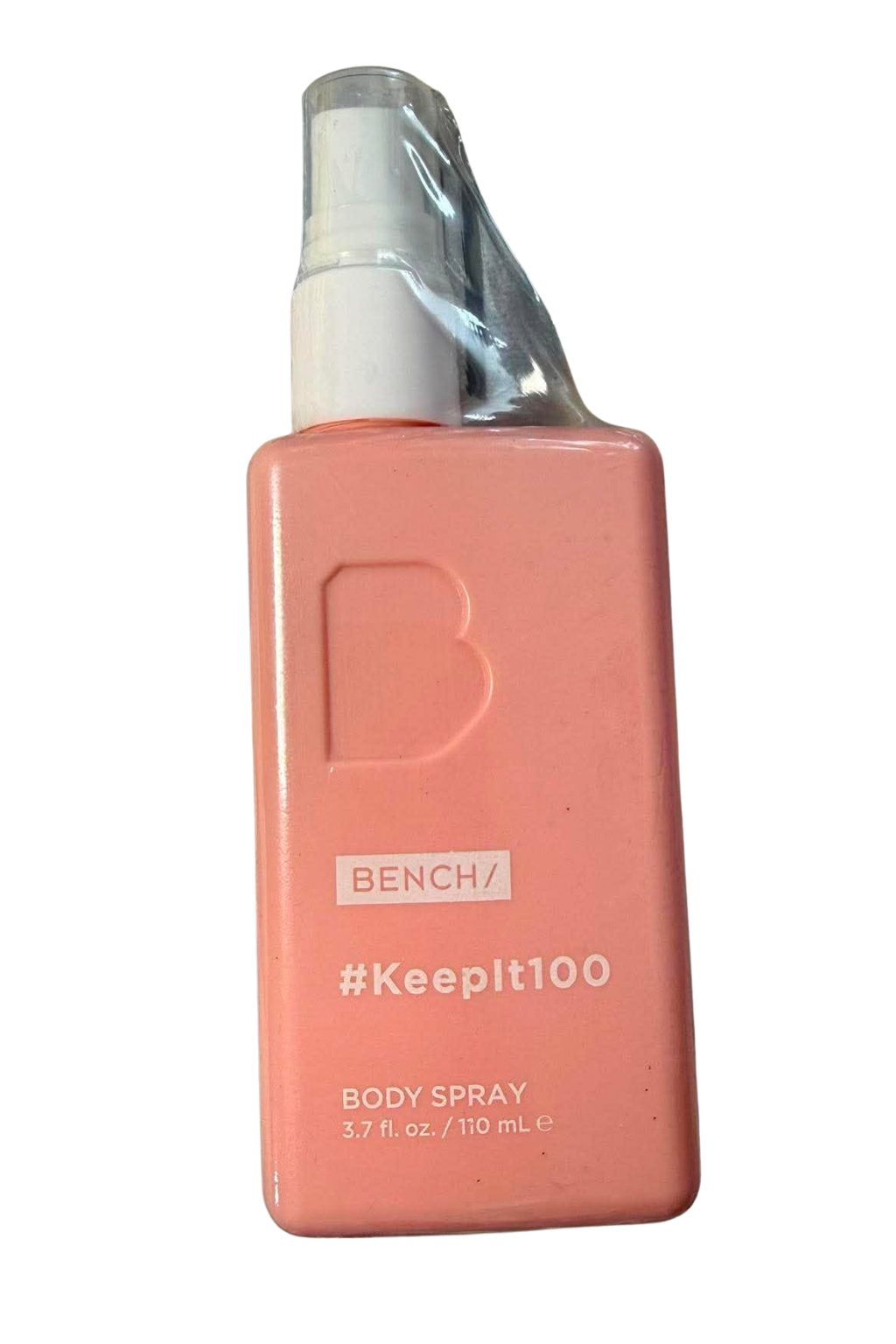 A pink rectangular bottle of BENCH body spray with a white spray nozzle and a clear protective wrapper around the top, on a white background.