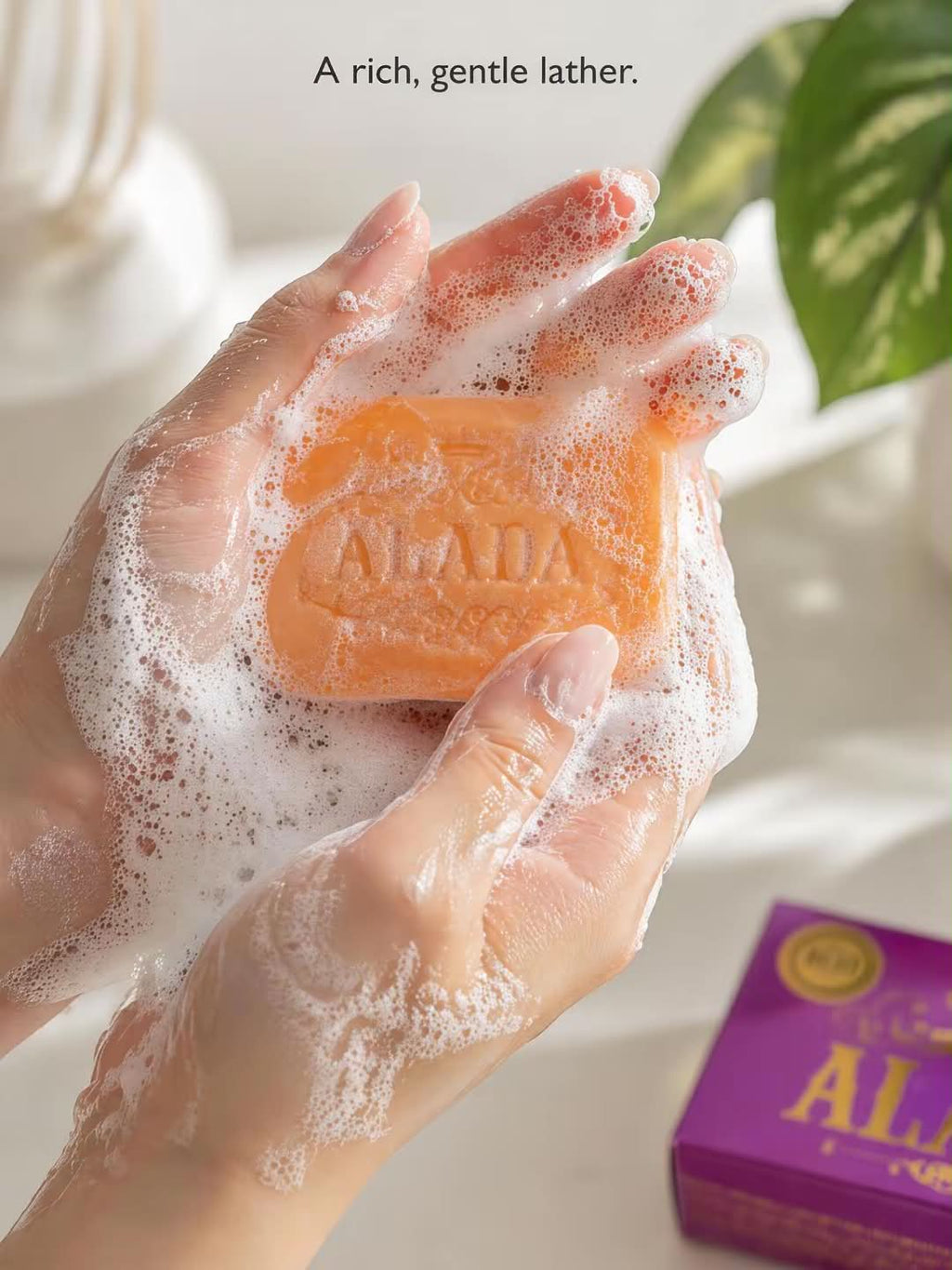 Alada 100% Natural Radiance Soap bar with a white and green packaging design, showcasing the natural ingredients on the label.